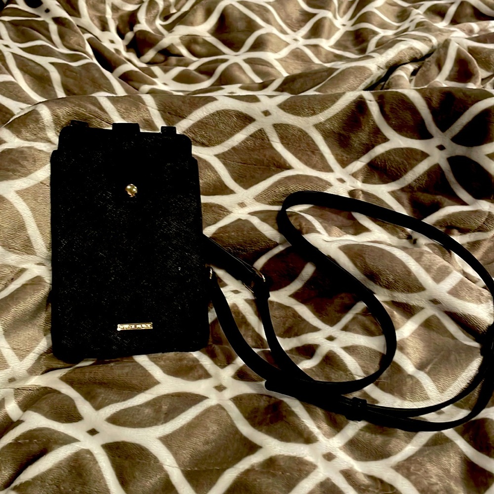 Crossbody phone holder with adjustable strap and wrist strap. Never used